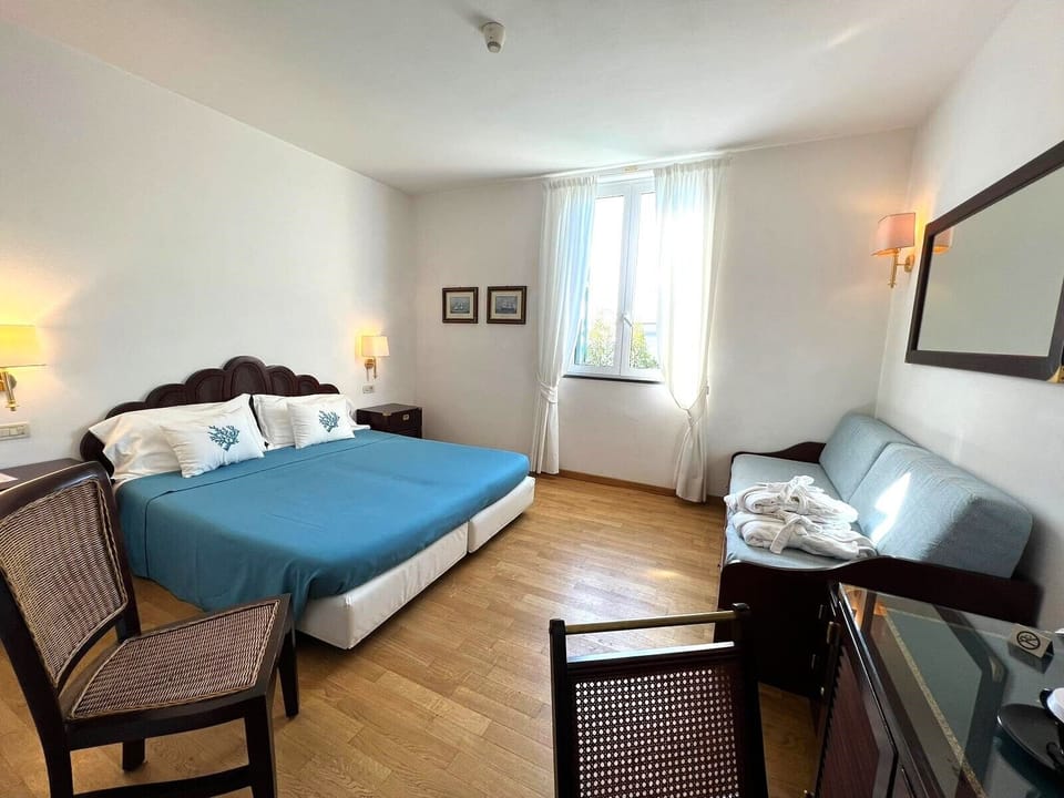 Triple Room | Down comforters, minibar, in-room safe, desk