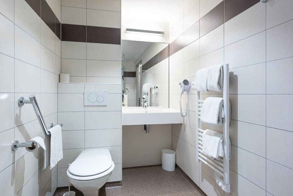 Shower, eco-friendly toiletries, hair dryer, towels