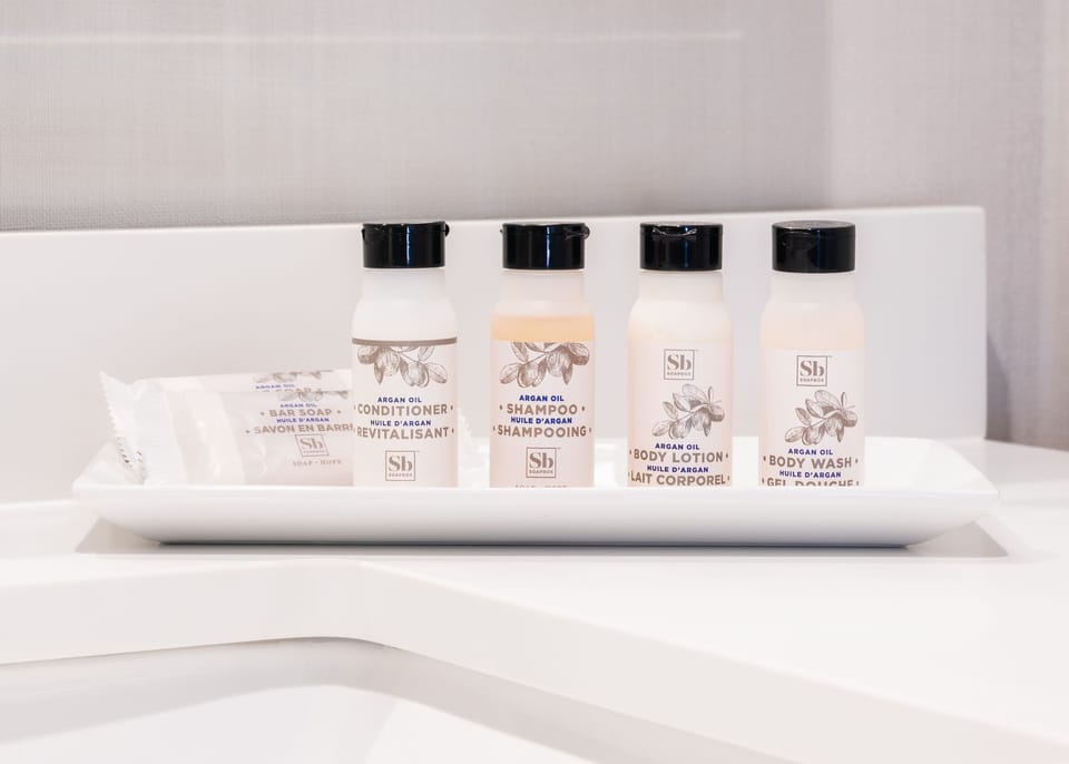 Combined shower/tub, hair dryer, towels, soap