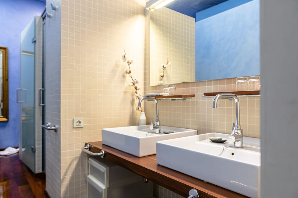 Suite, 2 Bedrooms, Balcony | Bathroom | Slippers, towels