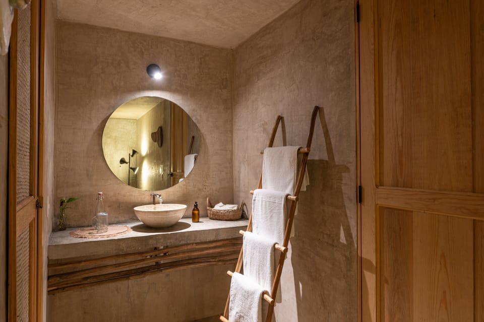Deluxe room with two double beds | Bathroom | Shower, designer toiletries, towels, soap