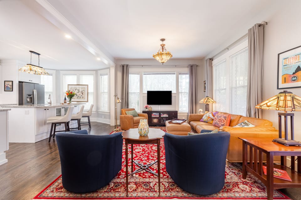 Open concept living room/kitchen. 12 original windows for natural light.