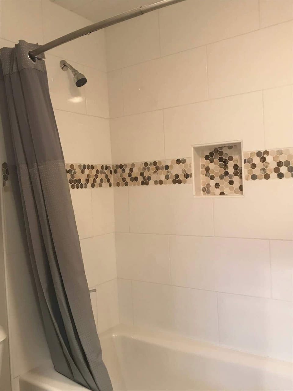Nice tile surround in second bath room 