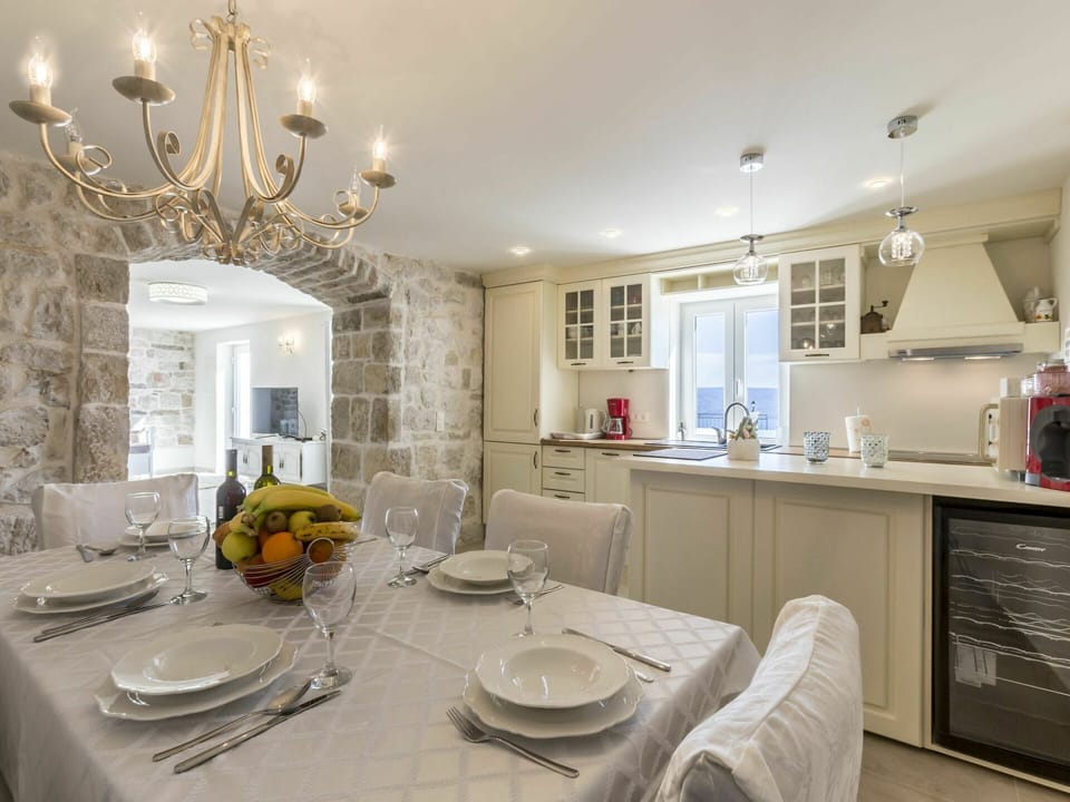 Table, Furniture, Property, Cabinetry, Tableware, Dishware, Lighting, Interior Design, Architecture