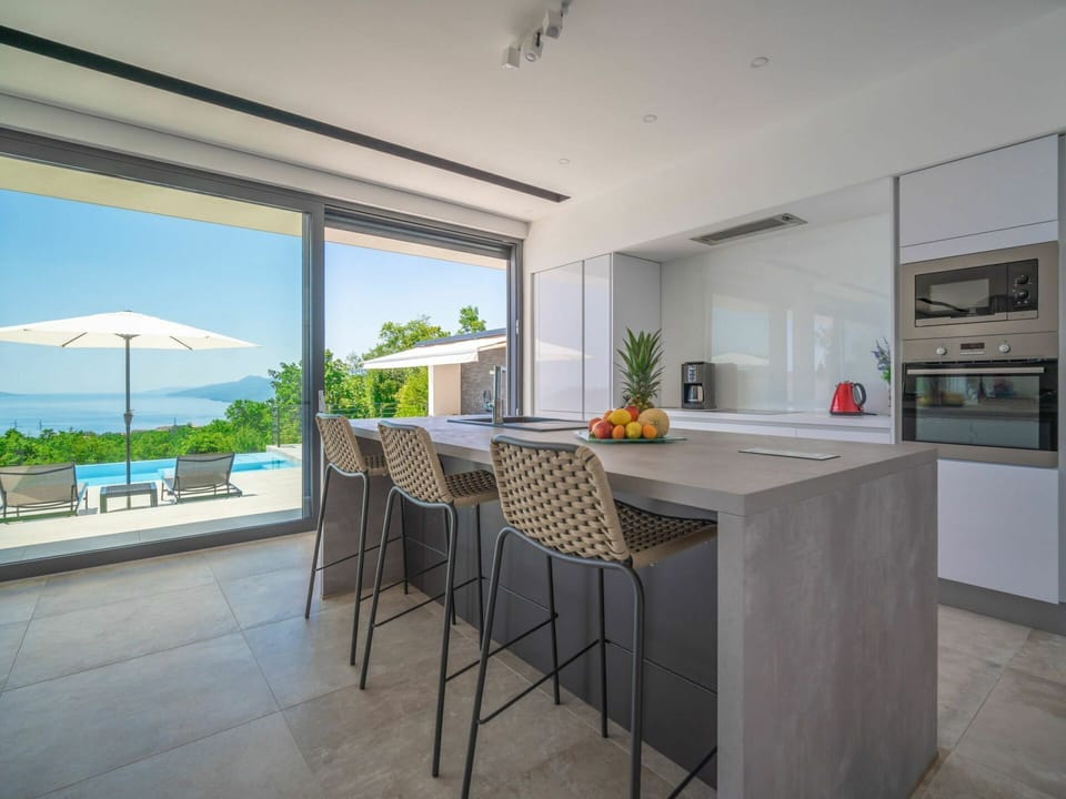 Cabinetry, Countertop, Table, Plant, Building, Chair, Window, Kitchen, Interior Design, Sky