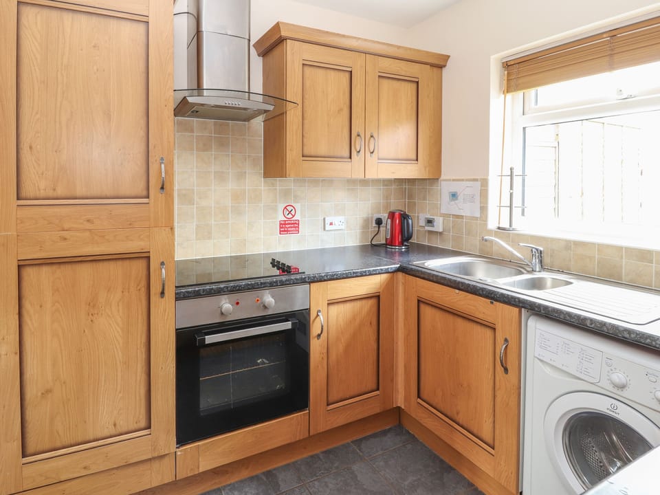 Cottage | Private kitchen | Fridge, oven, stovetop, highchair
