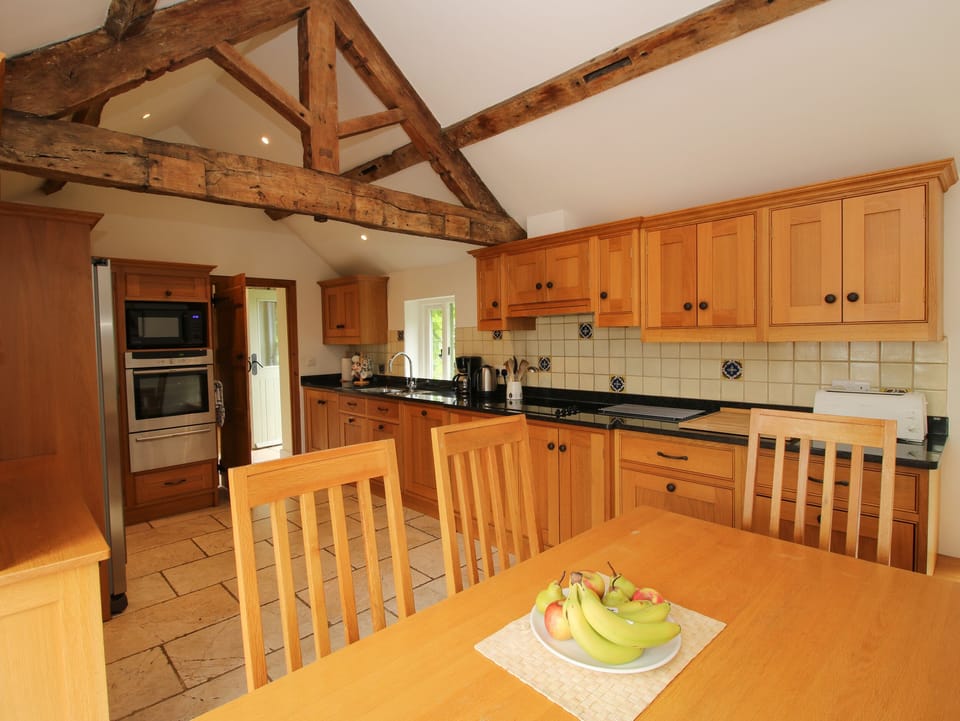 Cottage | Private kitchen | Stovetop, dishwasher, highchair, cookware/dishes/utensils