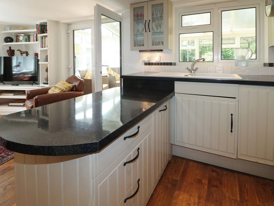 Cottage | Private kitchen | Stovetop, dishwasher, highchair, cookware/dishes/utensils