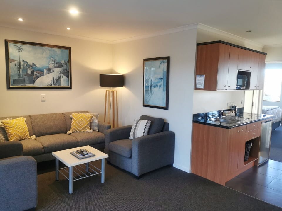 Standard Suite, 2 Bedrooms, Non Smoking, Kitchen (Units) | Living area | Flat-screen TV, DVD player