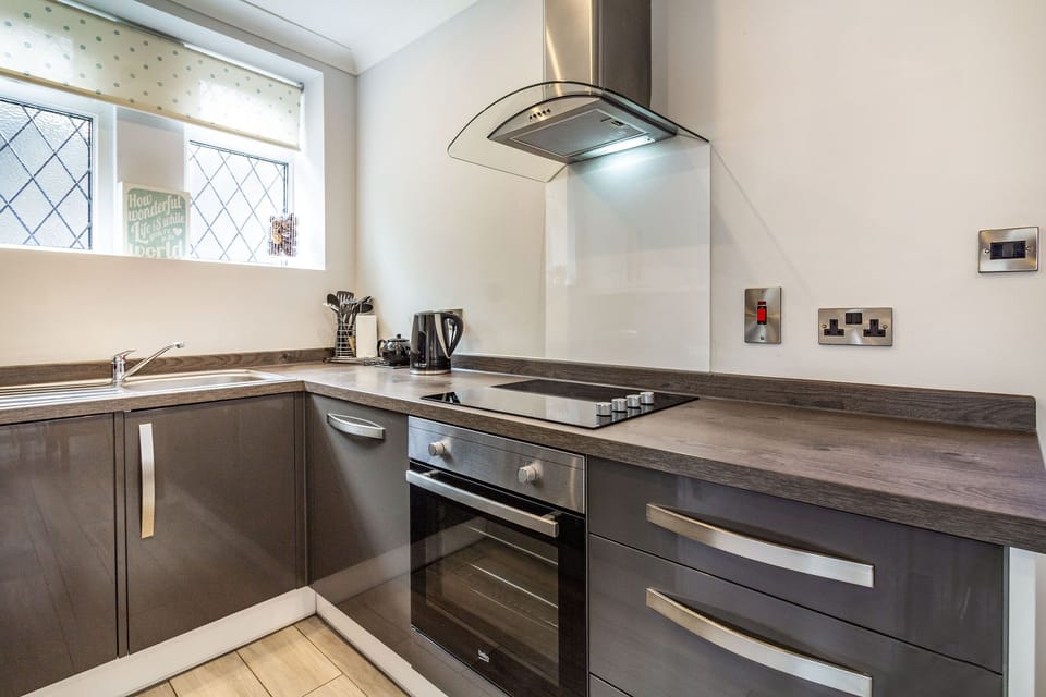 Cottage | Private kitchen | Stovetop, dishwasher, highchair, cookware/dishes/utensils