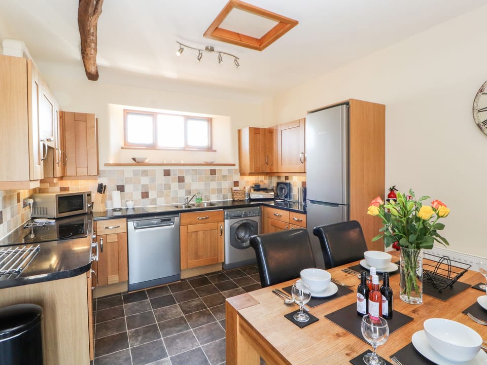 Cottage | Private kitchen | Stovetop, dishwasher, highchair, cookware/dishes/utensils