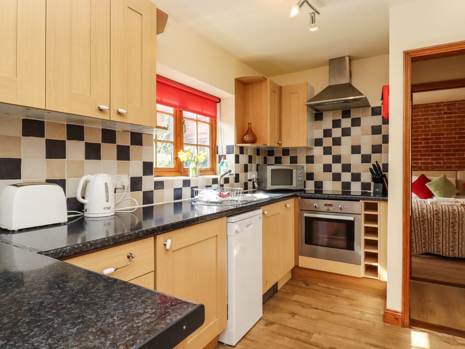 Cottage | Private kitchen | Stovetop, dishwasher, highchair, cookware/dishes/utensils