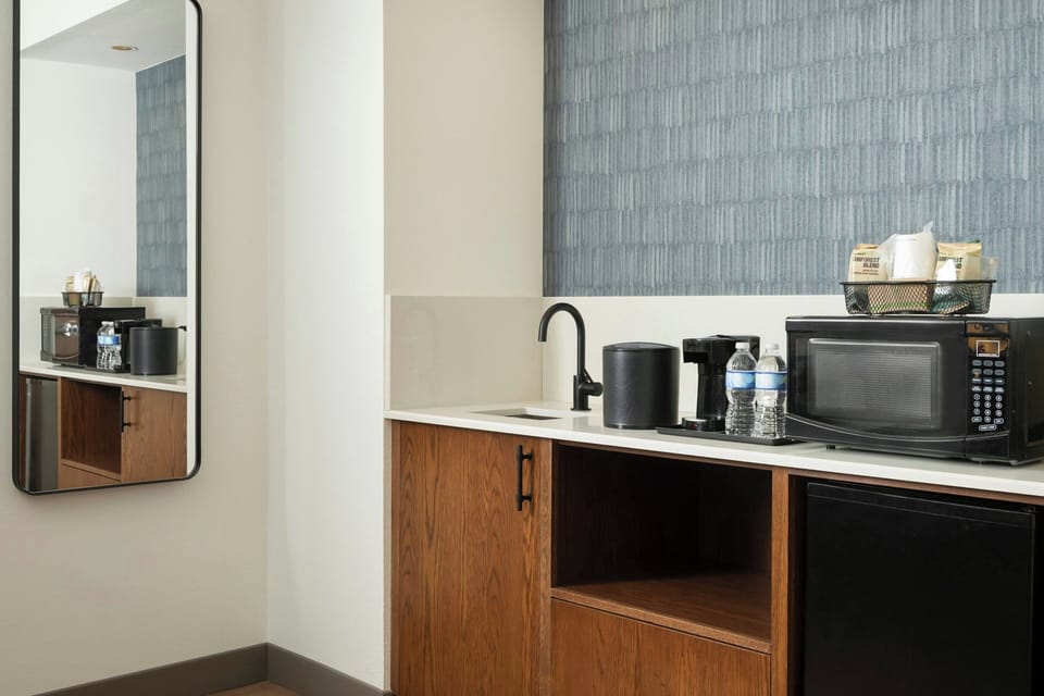 Premium bedding, desk, laptop workspace, iron/ironing board