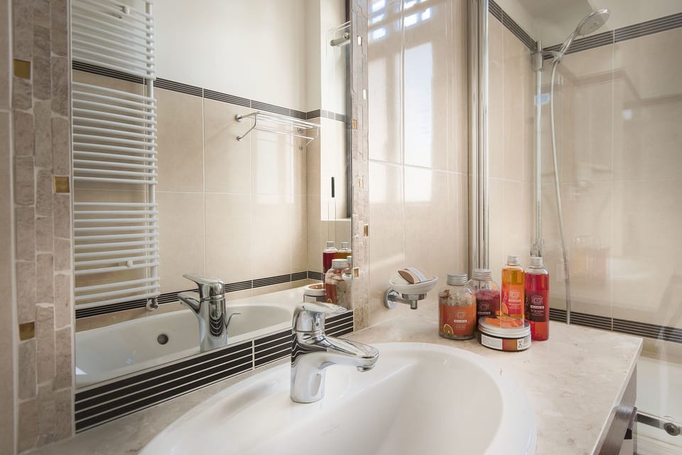 Twin Room | Bathroom | Designer toiletries, hair dryer, slippers, towels