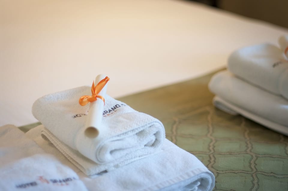 Twin Room | Bathroom amenities | Designer toiletries, hair dryer, slippers, towels