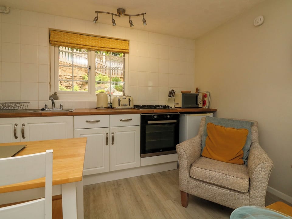Cottage | Private kitchen | Fridge, microwave, stovetop, highchair
