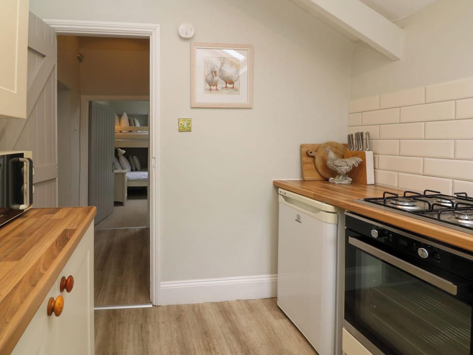 Cottage | Private kitchen | Fridge, microwave, stovetop, highchair