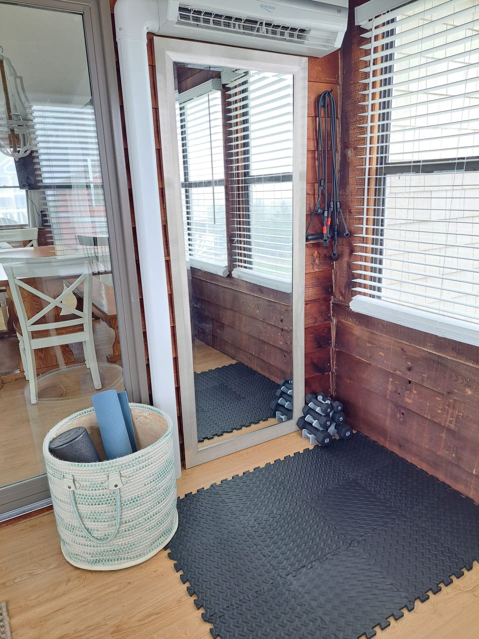 workout area with free weights, resistance bands, yoga mat and foam roller