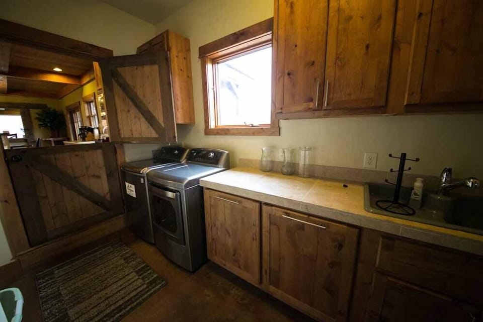 Laundry room with 2012 top of the line LG machines. Dryer has steam.