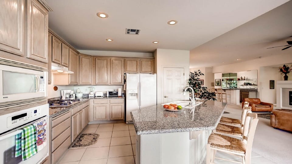 Another view of kitchen with island and seating