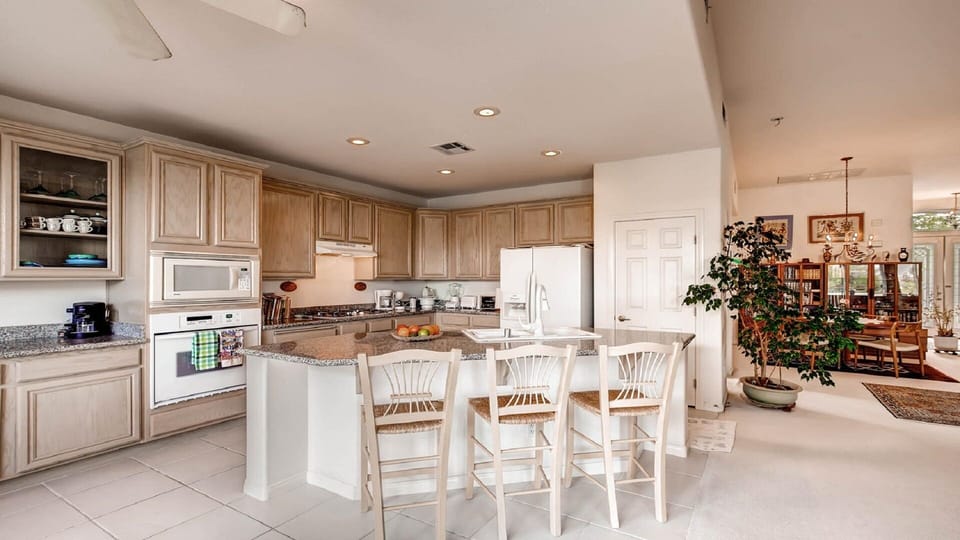 Close view of kitchen; dining in background