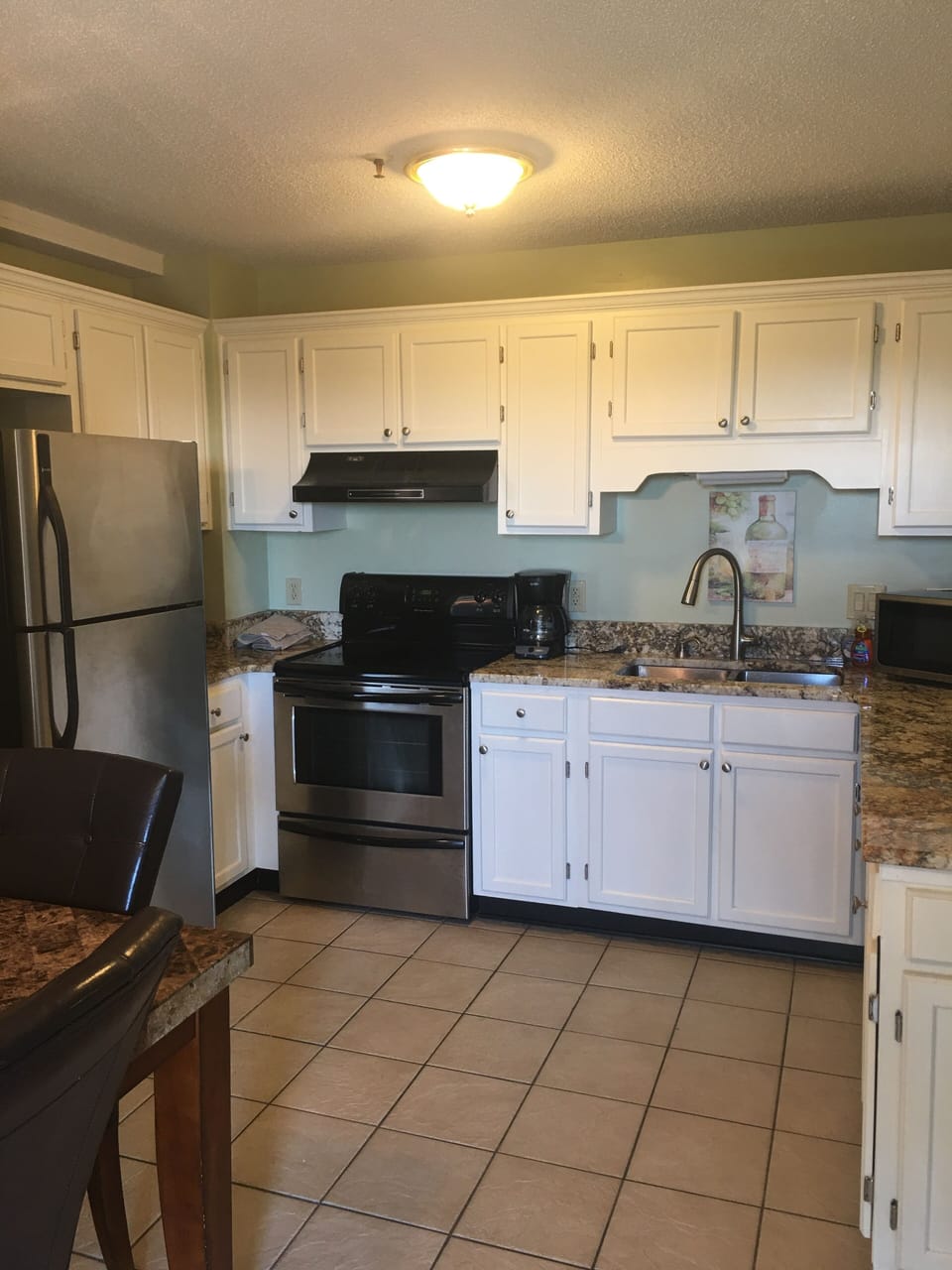 Kitchen with stainless steel appliances and granite countertops 