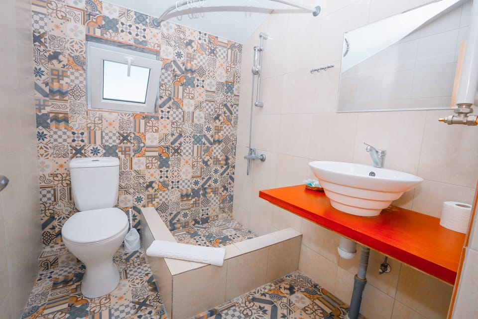 Shower, free toiletries, hair dryer, slippers