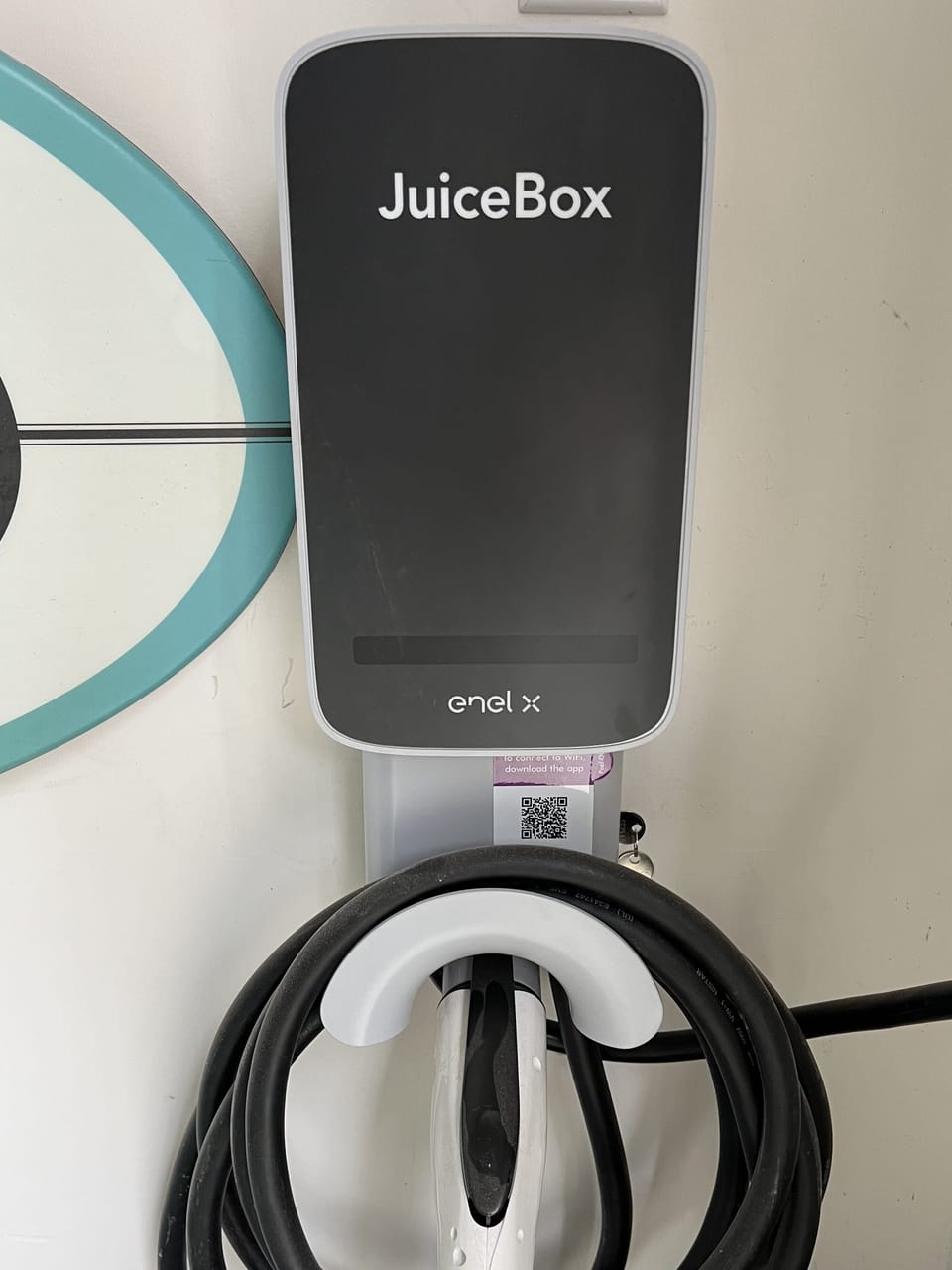 EV charger is available for use for a fee off the rear garage.