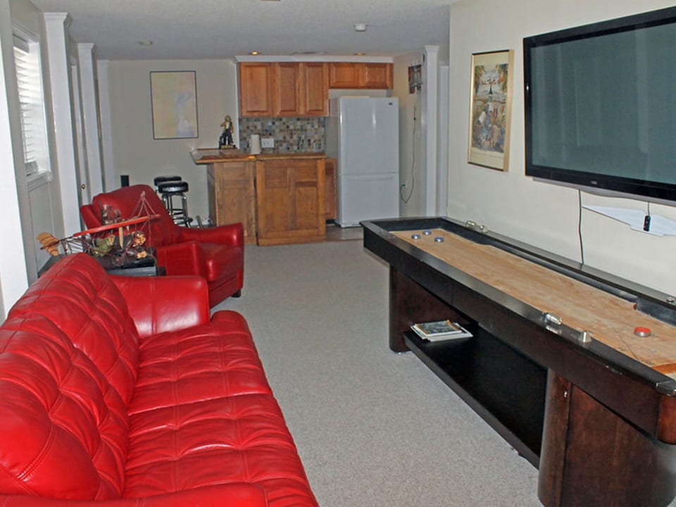 Lower level wet bar, refrig, coffee maker, microwave, blender nearby den/TV area