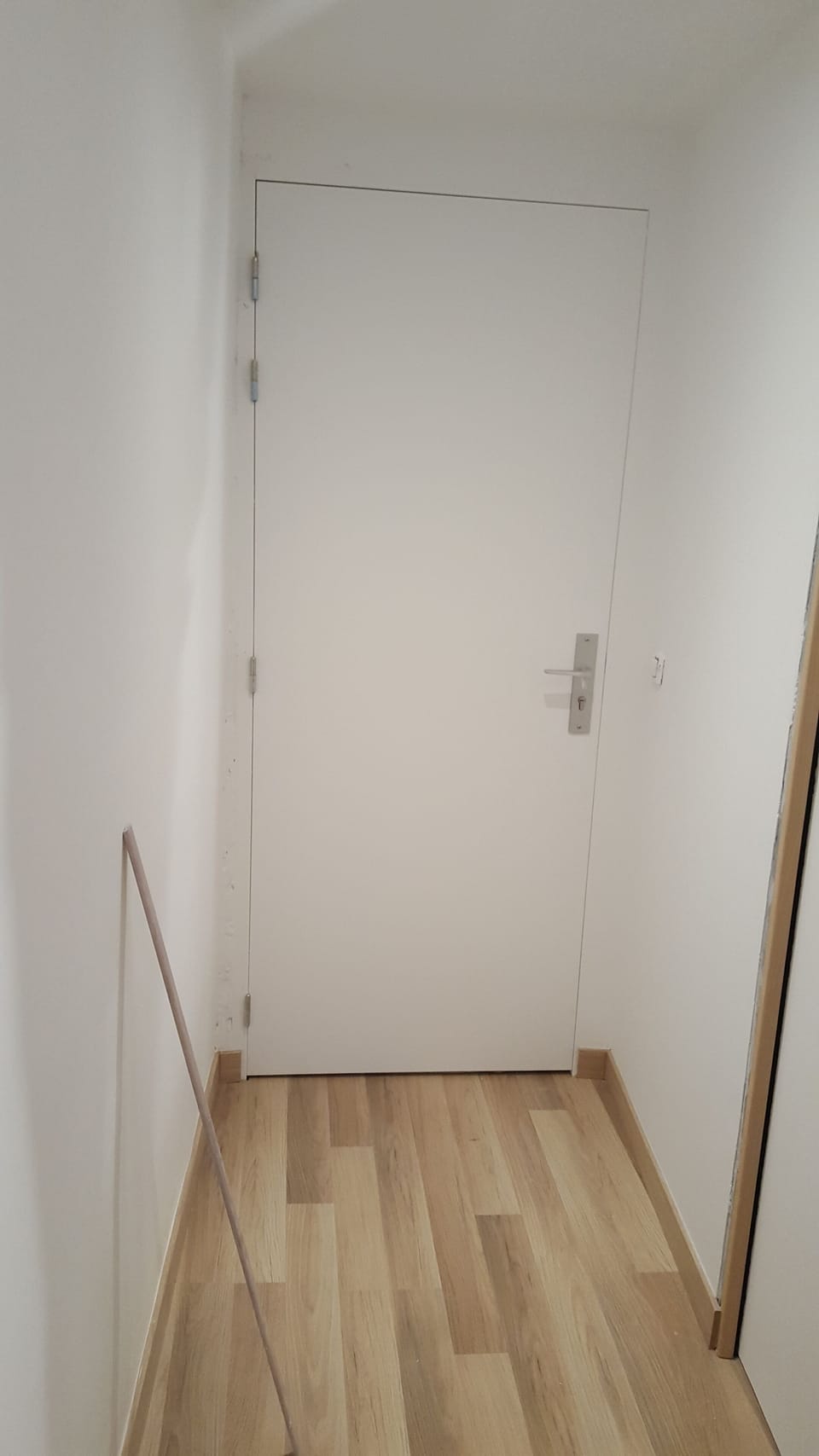 Inside the front entry.  Pardon the broom - we keep the space sparkling clean!