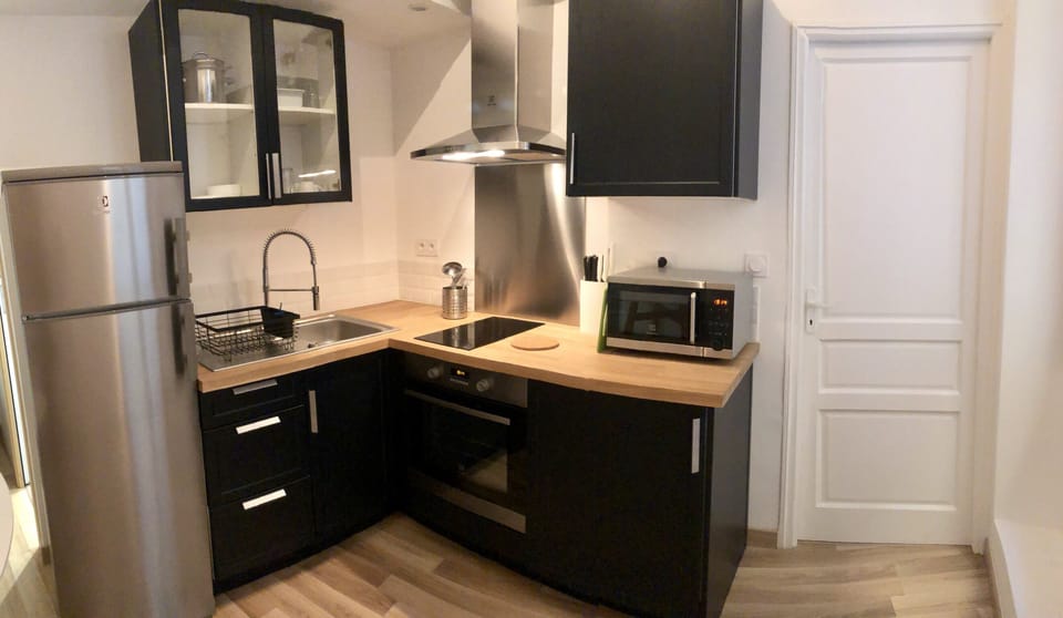The kitchen has utensils, cookware and serving ware.  Nespresso in the cabinet!