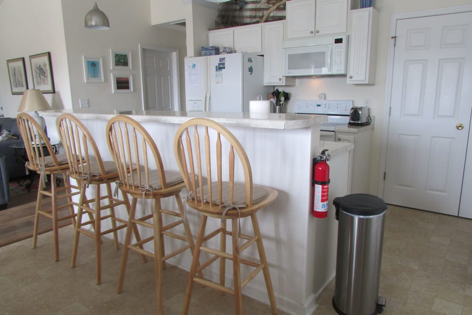 Bar height seating in dining/kitchen area.
Washer/dryer in closet on right