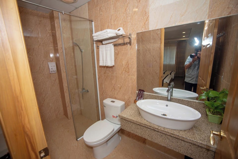 Deluxe Triple Room | Bathroom | Deep soaking tub, hair dryer, slippers, bidet
