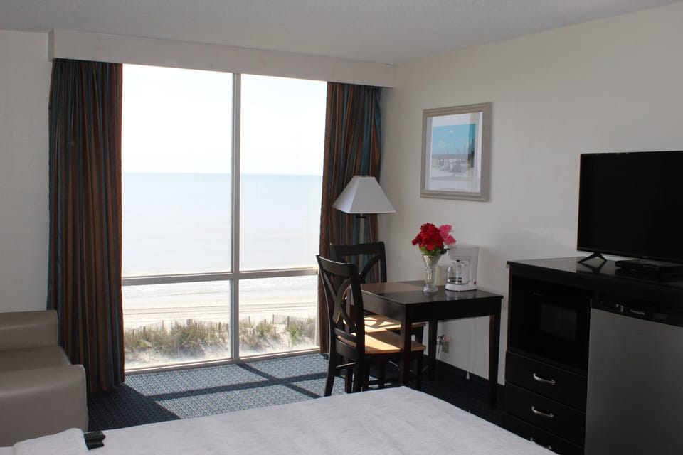 Economy Single Room, 1 King Bed, Beach View, Oceanfront | Living area | TV