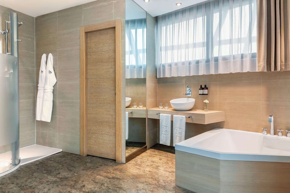 Shower, eco-friendly toiletries, hair dryer, towels