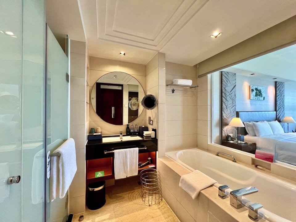 Separate tub and shower, rainfall showerhead, free toiletries