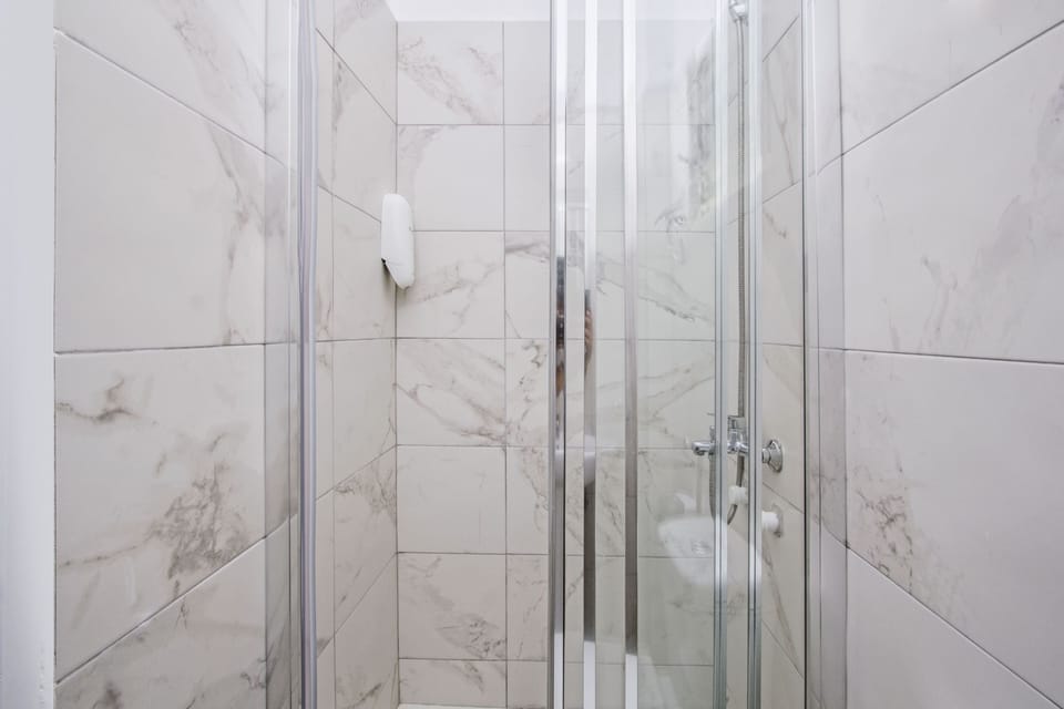 Shower, free toiletries, hair dryer, slippers