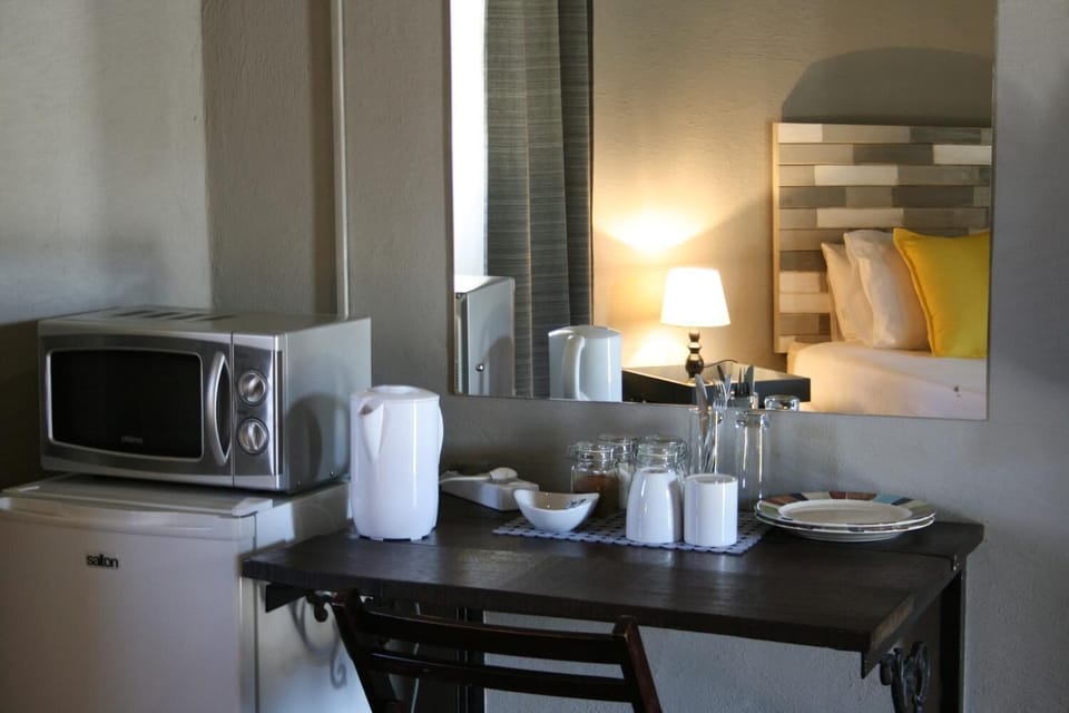 Cheetah Chalet | Private kitchen | Fridge, electric kettle