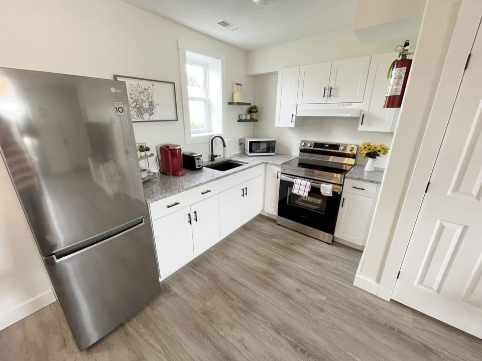 Family Suite, 2 Bedrooms, Kitchen, Bay View | Private kitchen | Coffee/tea maker, full-size fridge, electric kettle, coffee grinder