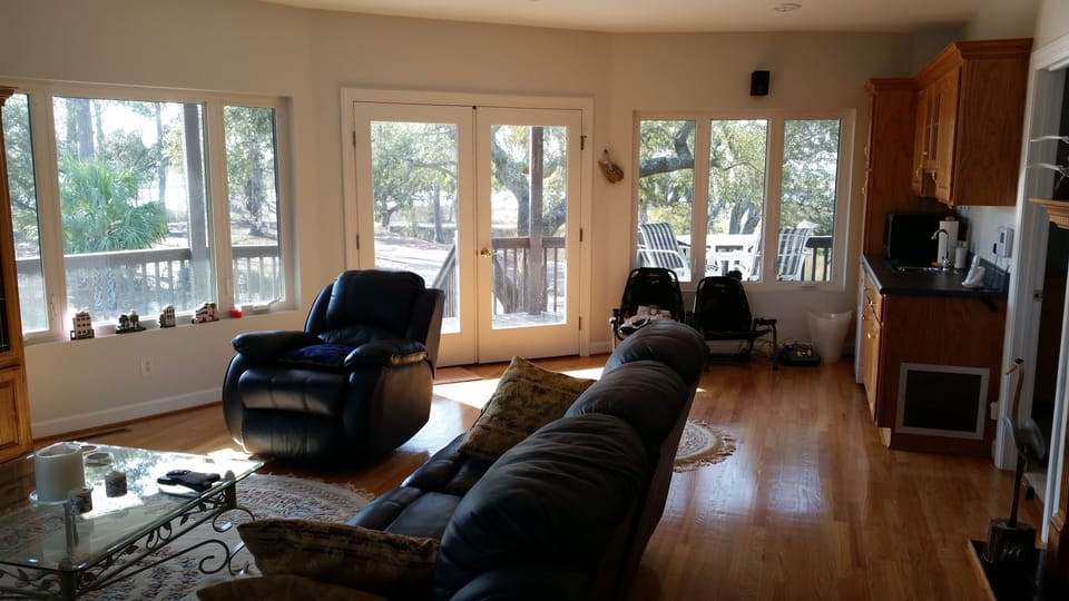 downstairs living area with view of deck and outside