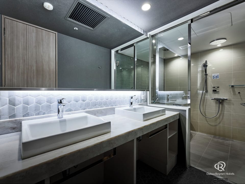 Separate tub and shower, free toiletries, hair dryer, slippers
