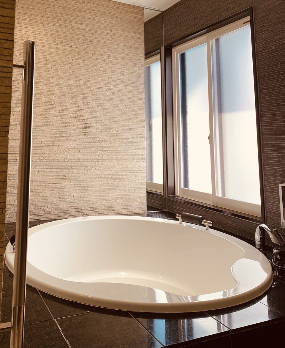 Executive Suite, Non Smoking | Bathroom | Separate tub and shower, free toiletries, slippers, electronic bidet