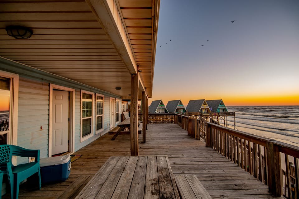 Spacious front deck with two picnic tables 