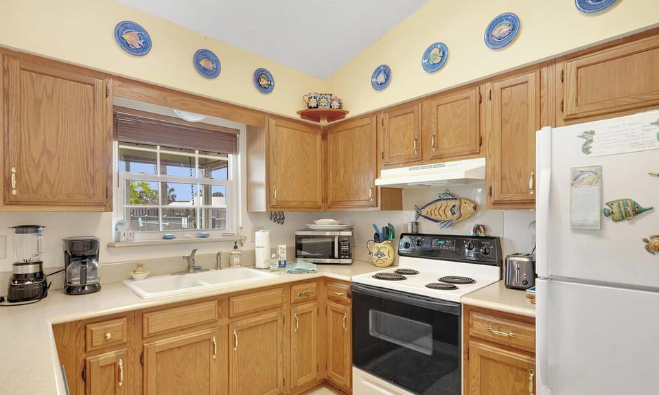 kitchen looking out to screen room