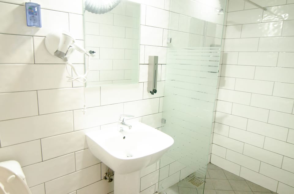 Shower, free toiletries, slippers, towels