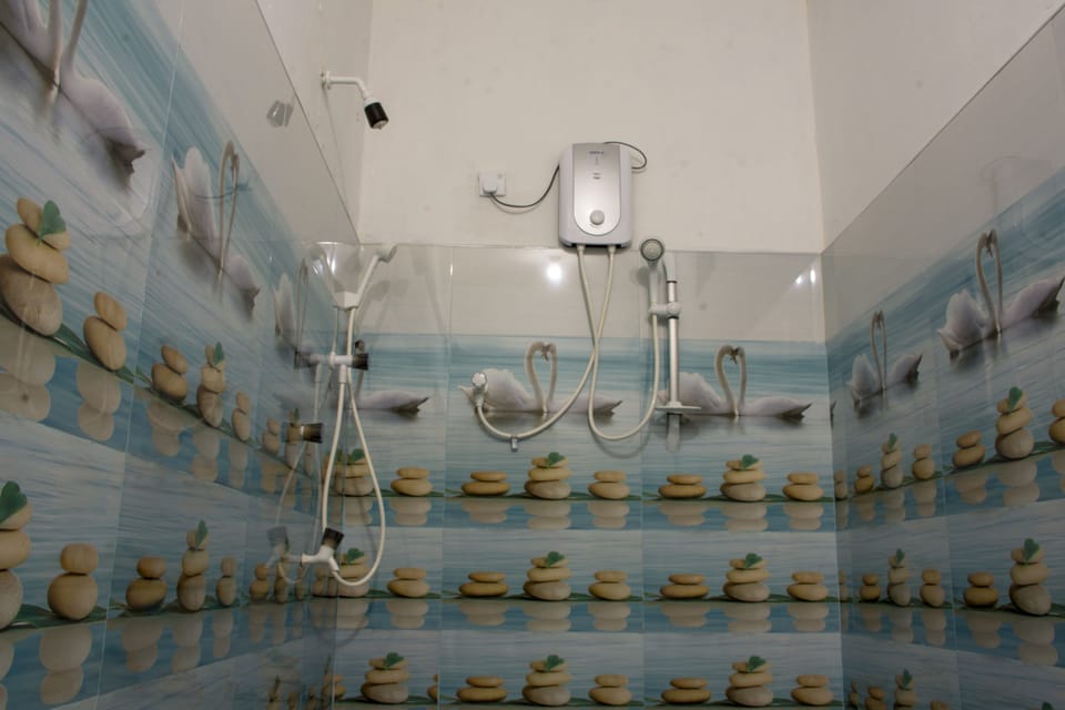 Family Room, Multiple Beds, Balcony, Garden View | Bathroom | Shower, rainfall showerhead, free toiletries, hair dryer