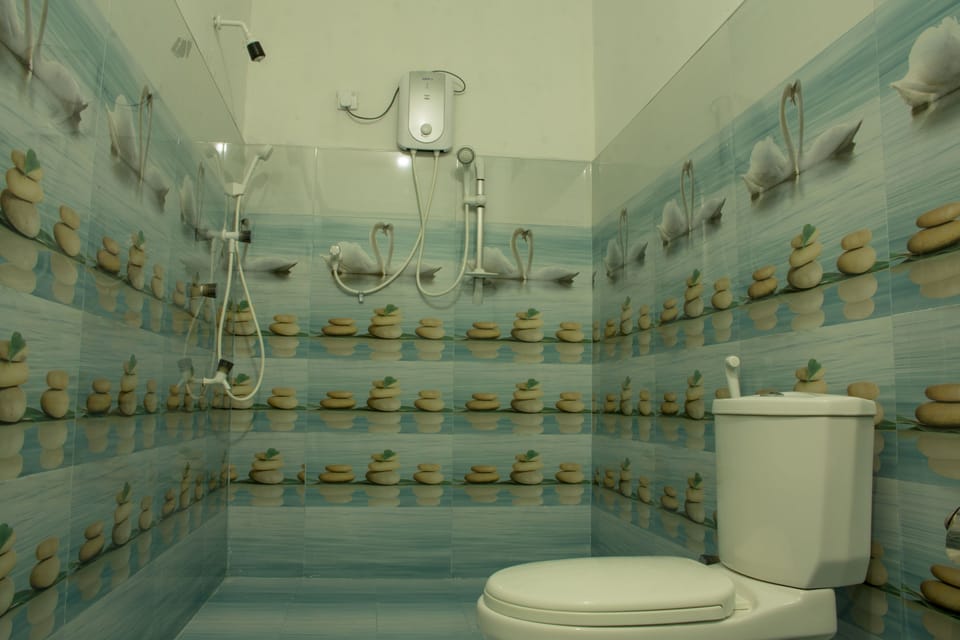 Family Room, Multiple Beds, Balcony, Garden View | Bathroom | Shower, rainfall showerhead, free toiletries, hair dryer