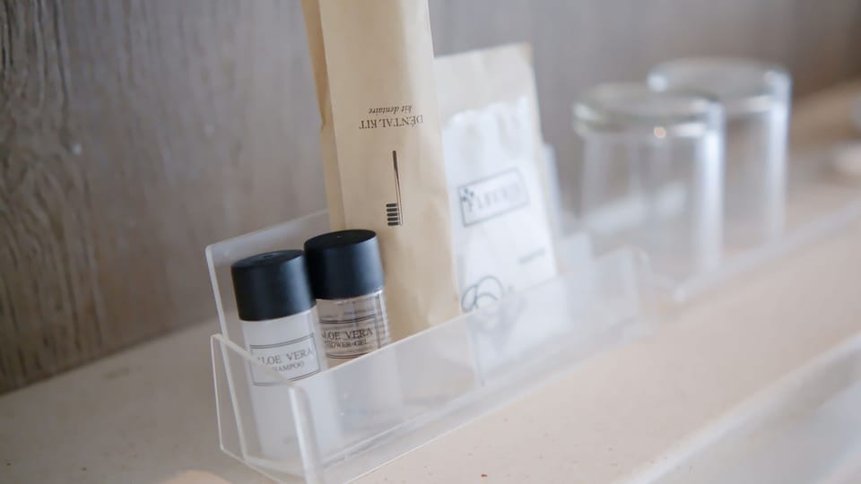 Shower, designer toiletries, hair dryer, bathrobes