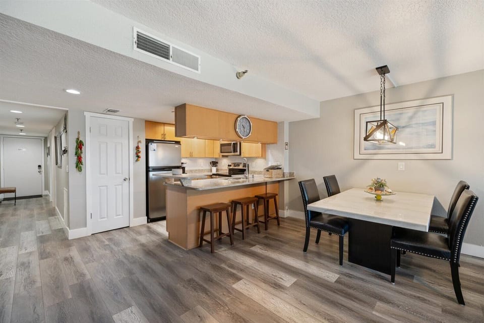 Kitchen Breakfast bar and dining.  Hallway entry to the left