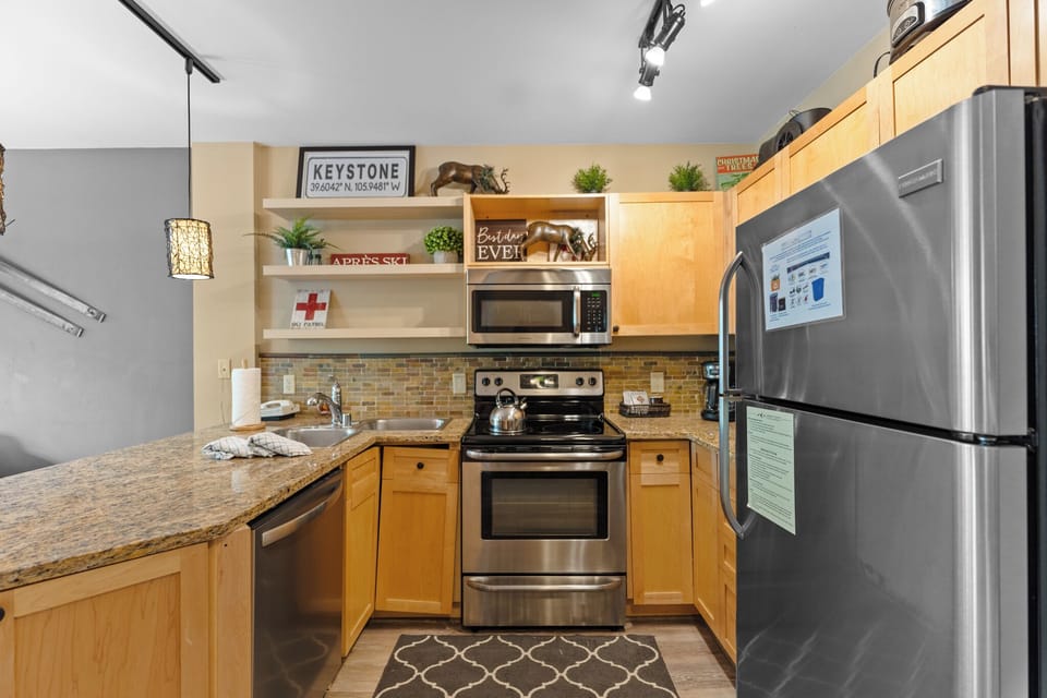 Your fully equipped kitchen awaits with granite countertops, stainless steel appliances, and everything needed to create memorable meals during your stay.